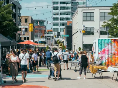Patrons walking the Gockel Block and looking at items from different vendors