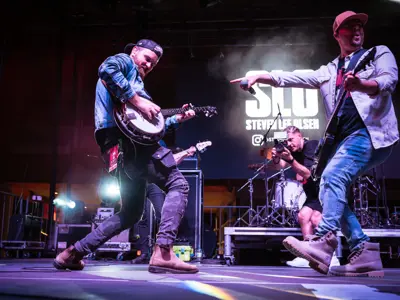 singer and guitarist on stage performing