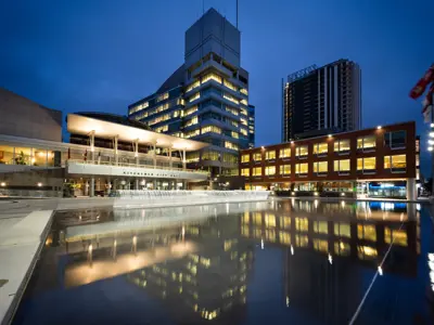 Evening photo of the exterior of City Hall