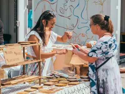 Individual purchasing an item from a Gaukel Block vendor